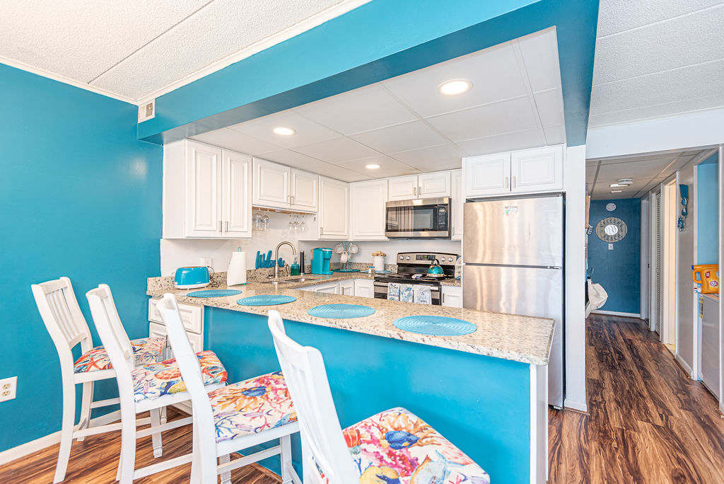 Full kitchen with granite counters