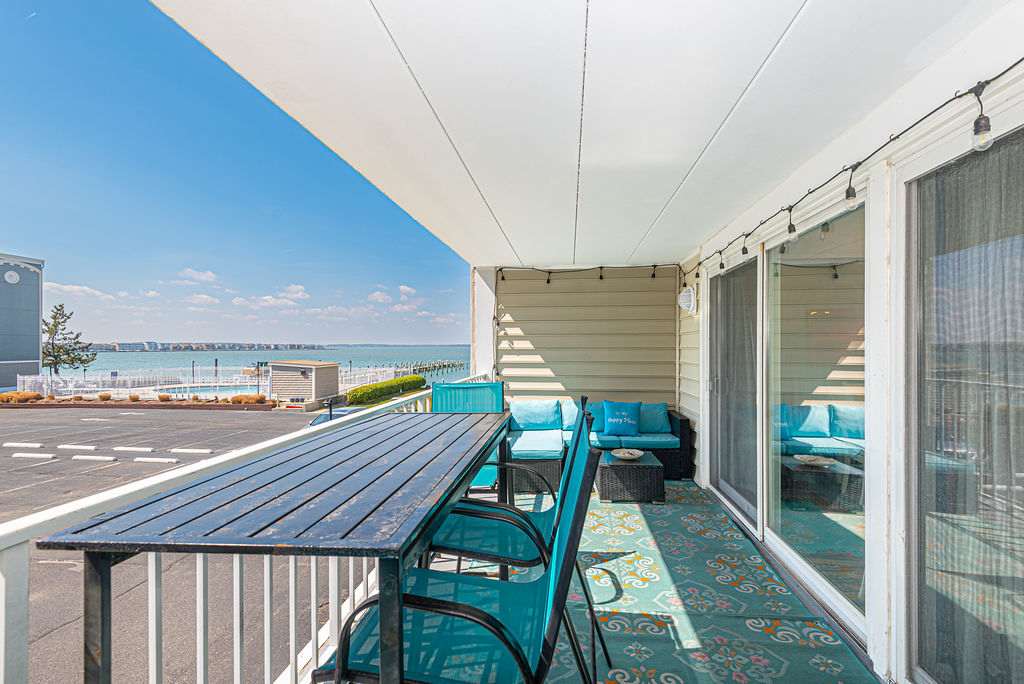 Bayfront balcony overlooking the pool